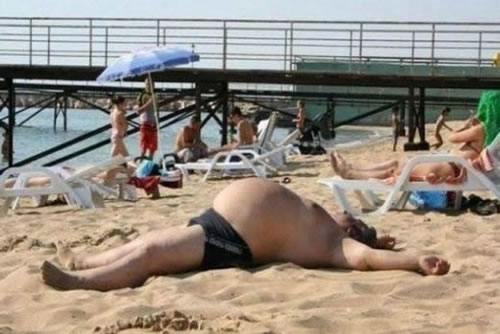 fat-guy-in-a-little-beach.jpg